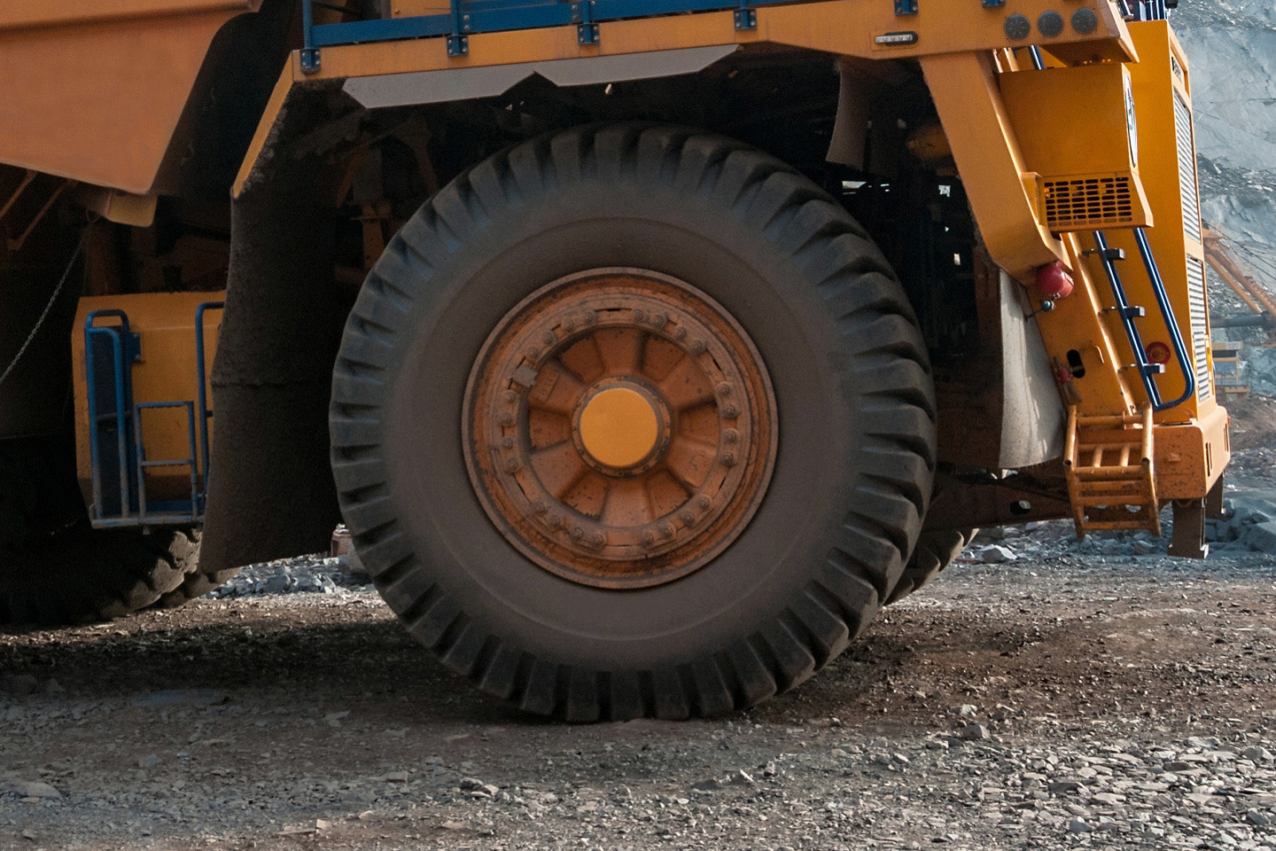 close up of wheel on yellow mining truck