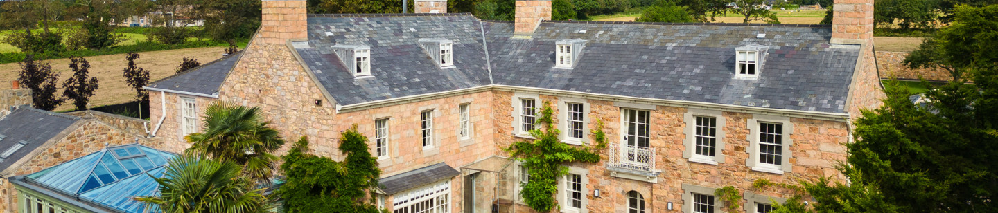 Jersey granite country house with a glass conservatory
