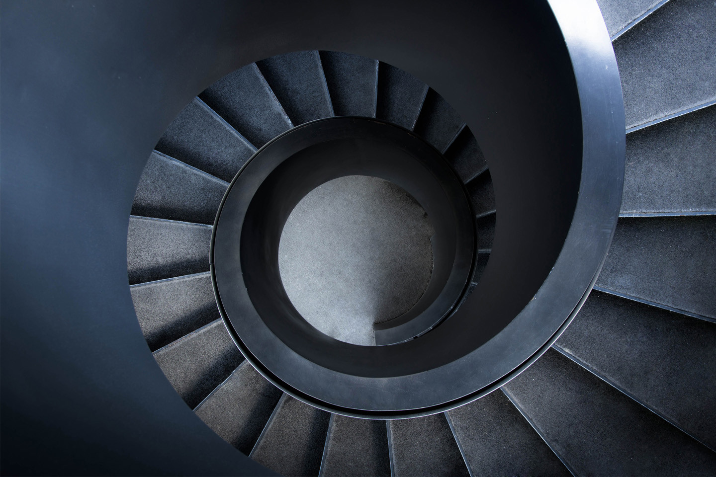 aerial view of dark metal spiral staircase