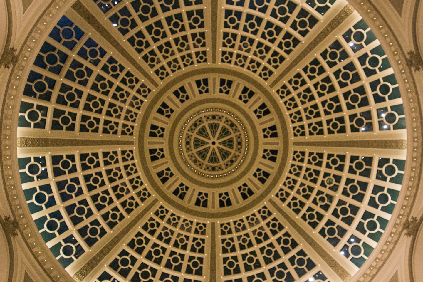 Intricately designed skylight in ceiling of dome shaped building 