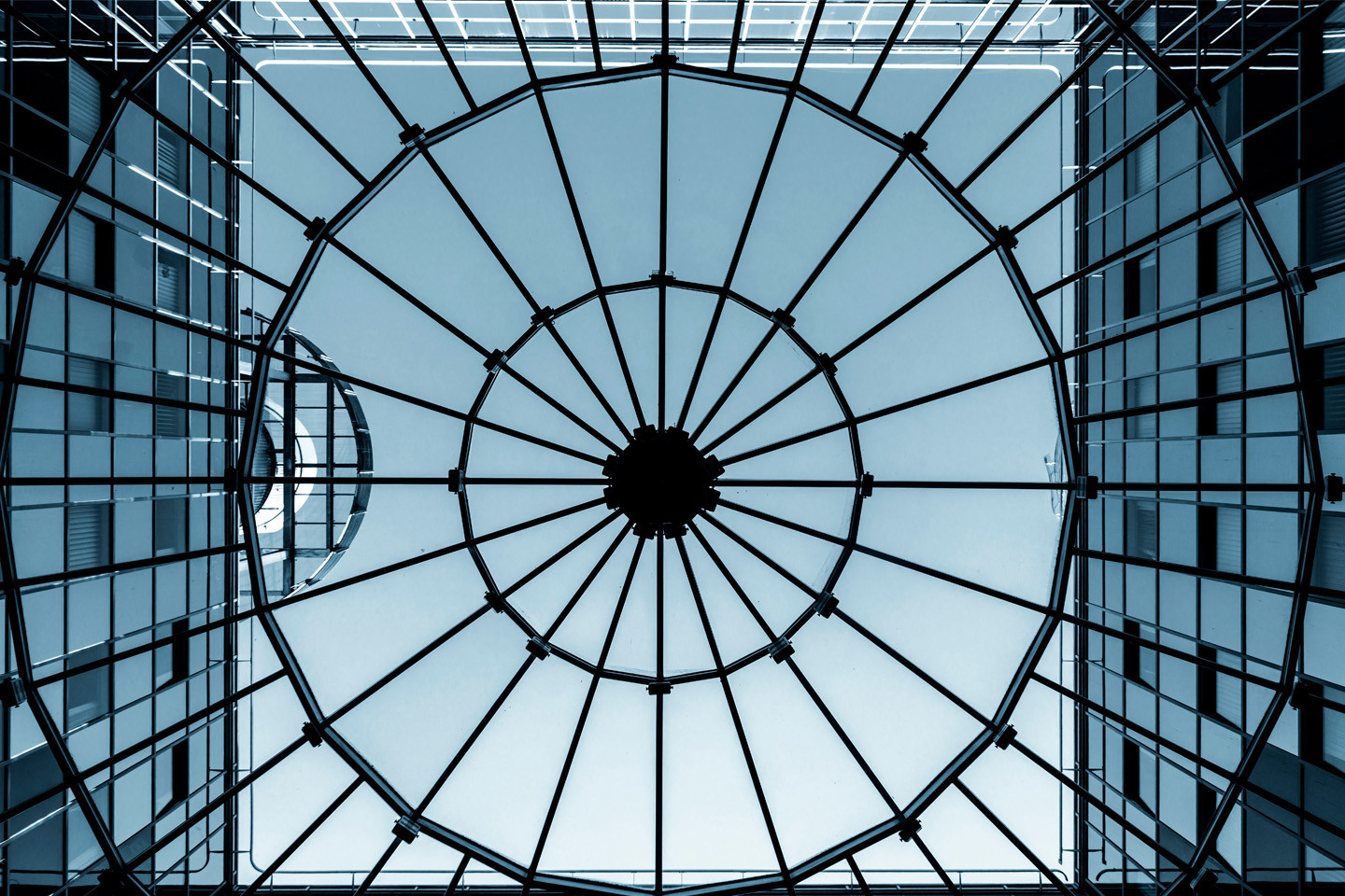 ground view of buildings with metal grate overlayed