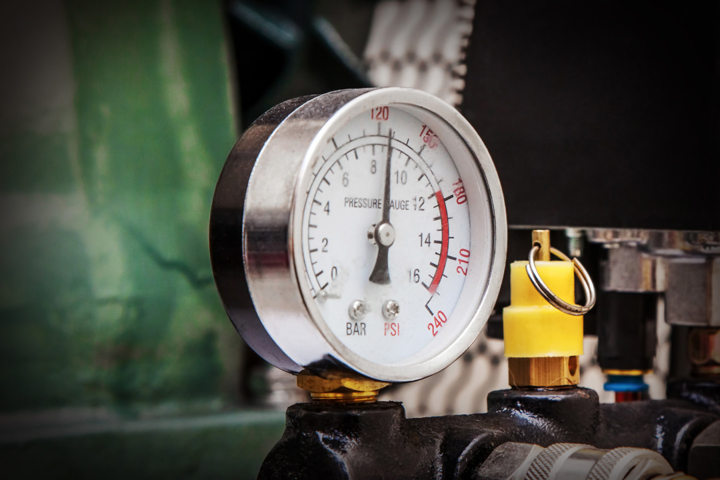 pressure gage attached to machinery 