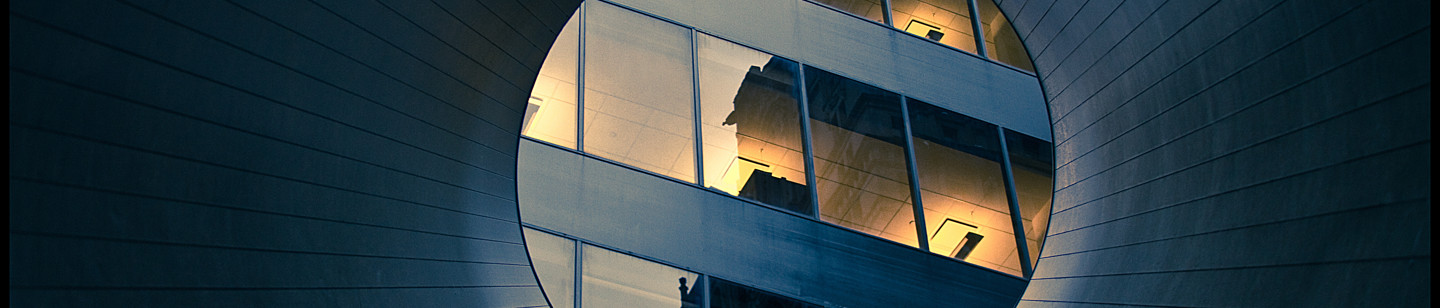 Reflection on high rise building windows through a tube