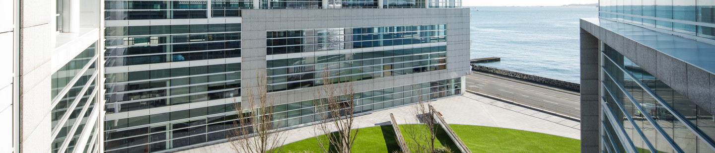 Square office building in Admiral Court, Guernsey with a sea view